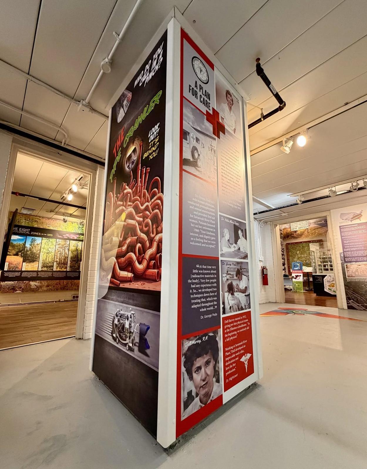 Four sided exhibit tower with dimensional graphics