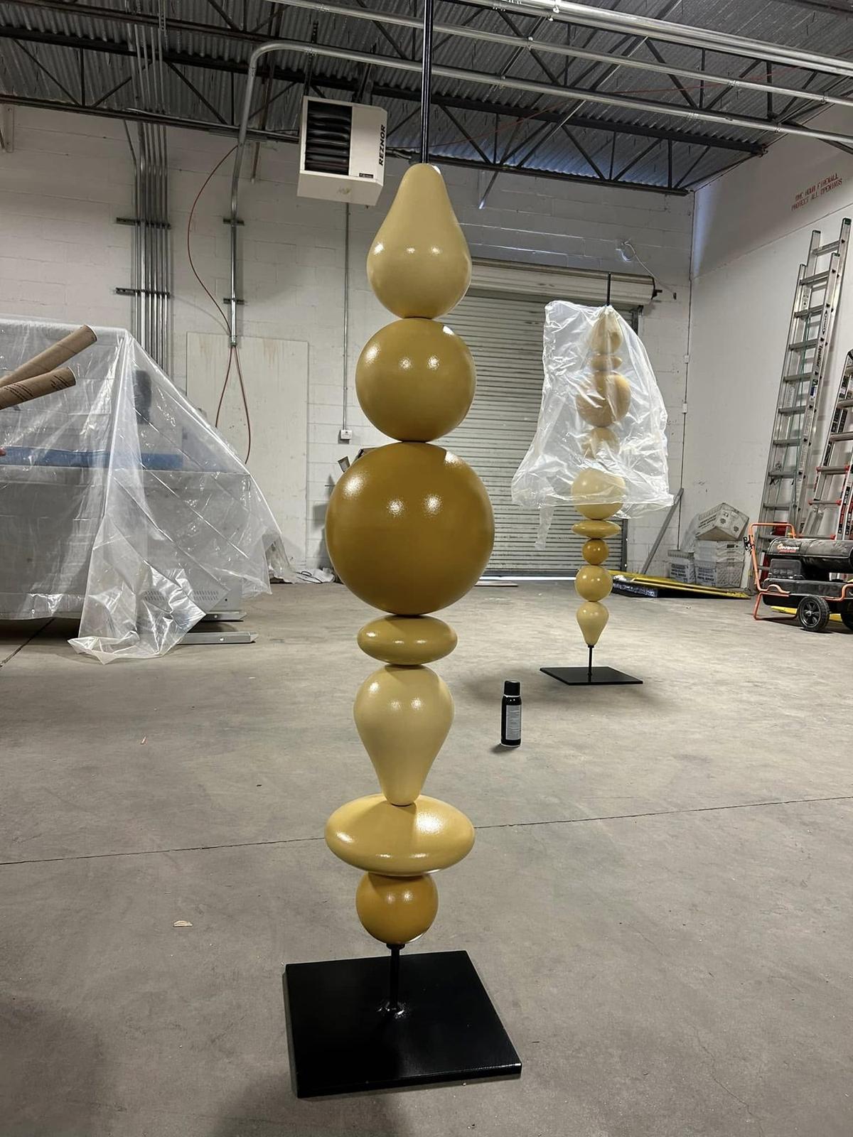 Stacked sculptural totems in finish, in the Peachtree Corners shop